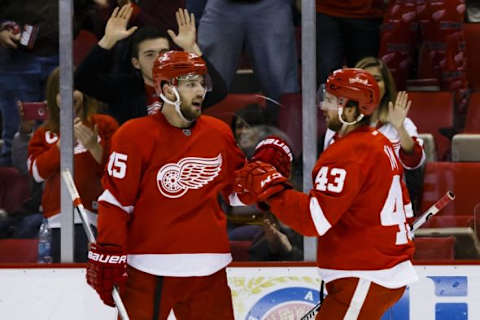 Feb 10, 2016; Detroit, MI, USA; Detroit Red Wings center Darren Helm (43) receives congratulations from center Riley Sheahan (15) after scoring in the third period against the Ottawa Senators at Joe Louis Arena. Detroit won 3-1. Mandatory Credit: Rick Osentoski-USA TODAY Sports