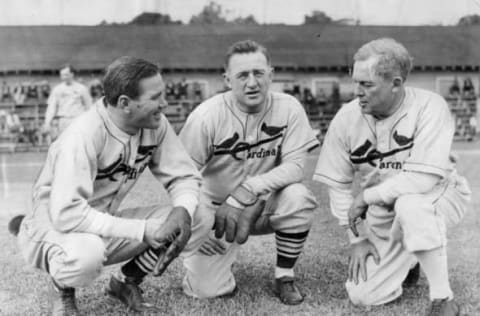 BRADENTON, FLORIDA – MARCH, 1935. Dizzy Dean, Frankie Frisch, and Sam Breadon discuss the upcoming St. Louis Cardinals season at spring training at Bradenton, Florida in March of 1935. (Photo by Mark Rucker/Transcendental Graphics, Getty Images)