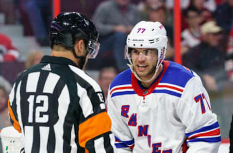 OTTAWA, ON – OCTOBER 5: Tony DeAngelo #77 of the New York Rangers has words with referee Justin St. Pierre #12 after a scrum in a game the Ottawa Senators at Canadian Tire Centre on October 5, 2019, in Ottawa, Ontario, Canada. (Photo by Jana Chytilova/Freestyle Photography/Getty Images)