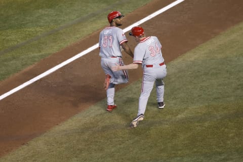 Otto Lopez is congratulated by third base coach Tim Leiper of Team Canada after hitting a three-run home run against Team Colombia during the eighth inning of the World Baseball Classic.. (Photo by Chris Coduto/Getty Images)