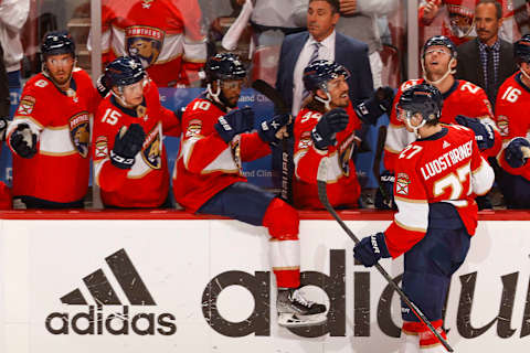 SUNRISE, FL – MAY 19: Teammates congratulate Eetu Luostarinen #27 of the Florida Panthers after he scored a second period goal against the Tampa Bay Lightning in Game Two of the Second Round of the 2022 NHL Stanley Cup Playoffs at the FLA Live Arena on May 19, 2022 in Sunrise, Florida. (Photo by Joel Auerbach/Getty Images)