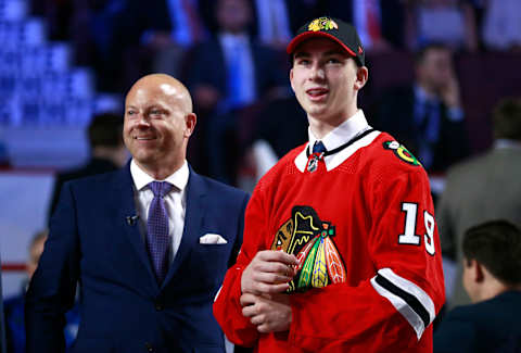 VANCOUVER, BRITISH COLUMBIA – JUNE 21: Kirby Dach, third overall pick by the Chicago Blackhawks, and general manager Stan Bowman smile on the draft floor during the first round of the 2019 NHL Draft at Rogers Arena on June 21, 2019 in Vancouver, Canada. (Photo by Jeff Vinnick/NHLI via Getty Images)