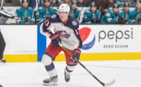 Apr 19, 2022; San Jose, California, USA; Columbus Blue Jackets center Kent Johnson (13) controls the puck during the third period against the San Jose Sharks at SAP Center at San Jose. Mandatory Credit: Stan Szeto-USA TODAY Sports