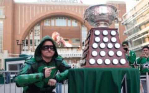 Oct 8, 2015; Dallas, TX, USA; Dallas Stars fan Matthew Day poses with the Art Ross Trophy prior to the Stars’ game against the Pittsburgh Penguins at American Airlines Center. Mandatory Credit: Jerome Miron-USA TODAY Sports