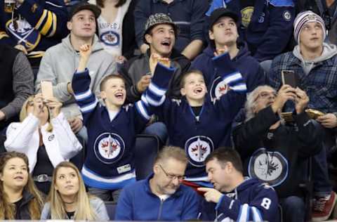 Oct 30, 2016; Winnipeg, Manitoba, CAN; Winnipeg Jets fans react during the second period break against Buffalo Sabres at MTS Centre. Mandatory Credit: Bruce Fedyck-USA TODAY Sports