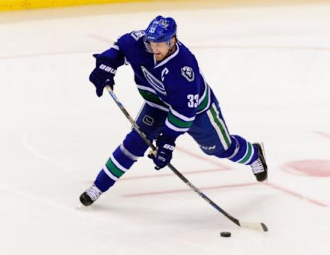 Jan 11, 2016; Vancouver, British Columbia, CAN; Vancouver Canucks forward Henrik Sedin (33) shoots the puck during the third period against the Florida Panthers at Rogers Arena. The Vancouver Canucks won 3-2 in overtime. Mandatory Credit: Anne-Marie Sorvin-USA TODAY Sports