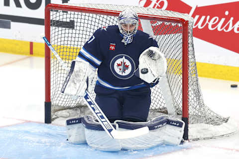 Apr 22, 2023; Winnipeg, Manitoba, CAN; Winnipeg Jets goaltender Connor Hellebuyck (37) warms up before a game against the Vegas Golden Knights in game three of the first round of the 2023 Stanley Cup Playoffs at Canada Life Centre. Mandatory Credit: James Carey Lauder-USA TODAY Sports