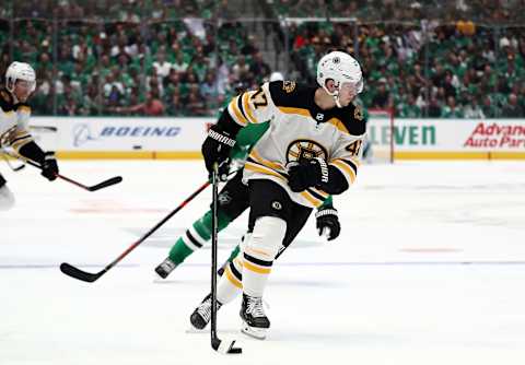 DALLAS, TEXAS – OCTOBER 03: Torey Krug #47 of the Boston Bruins skates the puck against the Dallas Stars in the second period at American Airlines Center on October 03, 2019 in Dallas, Texas. (Photo by Ronald Martinez/Getty Images)