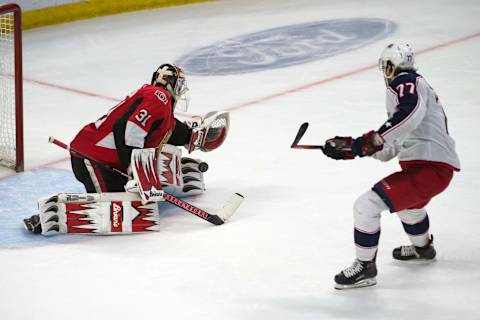 Apr 6, 2019; Ottawa, Ontario, CAN; Ottawa Senators goalie Anders Nilsson (31) makes a save on a shot from Columbus Blue Jackets right wing Josh Anderson (77) in the third period at the Canadian Tire Centre. Mandatory Credit: Marc DesRosiers-USA TODAY Sports