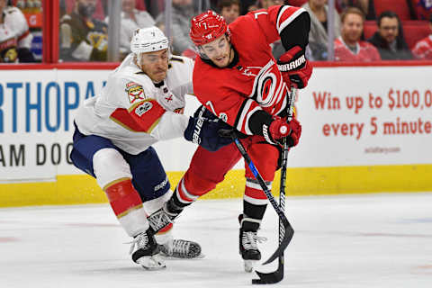 RALEIGH, NC – NOVEMBER 07: Carolina Hurricanes Center Derek Ryan (7) skates around Florida Panthers Right Wing Colton Sceviour (7) during a game between the Florida Panthers and the Carolina Hurricanes at the PNC Arena in Raleigh, NC on November 7 2017. Carolina defeated Florida 3-1. (Photo by Greg Thompson/Icon Sportswire via Getty Images)