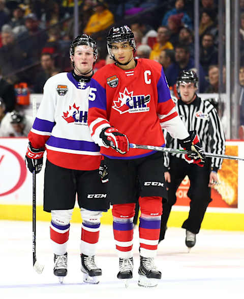 HAMILTON, ON – JANUARY 16: Alexis Lafreniere #11 of Team White and Quinton Byfield #55 of Team Red talk during the third period of the 2020 CHL/NHL Top Prospects Game at FirstOntario Centre on January 16, 2020 in Hamilton, Canada. (Photo by Vaughn Ridley/Getty Images)