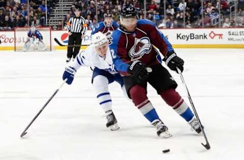 Dec 22, 2016; Denver, CO, USA; Colorado Avalanche right wing Jarome Iginla (12) controls the puck as Toronto Maple Leafs center Leo Komarov (47) defends in the second period at the Pepsi Center. Mandatory Credit: Isaiah J. Downing-USA TODAY Sports