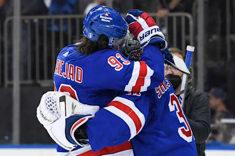 May 11, 2022; New York, New York, USA; New York Rangers center Mika Zibanejad (93) congratulates New York Rangers goaltender Igor Shesterkin (31) in beating the Pittsburgh Penguins 4-3 after game five of the first round of the 2022 Stanley Cup Playoffs at Madison Square Garden. Mandatory Credit: Dennis Schneidler-USA TODAY Sports