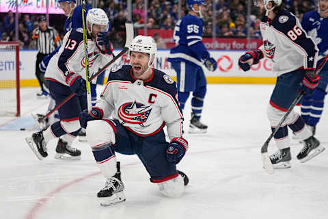 Feb 11, 2023; Toronto, Ontario, CAN; Columbus Blue Jackets forward Boone Jenner (38) celebrates his goal against the Toronto Maple Leafs during the second period at Scotiabank Arena. Mandatory Credit: John E. Sokolowski-USA TODAY Sports