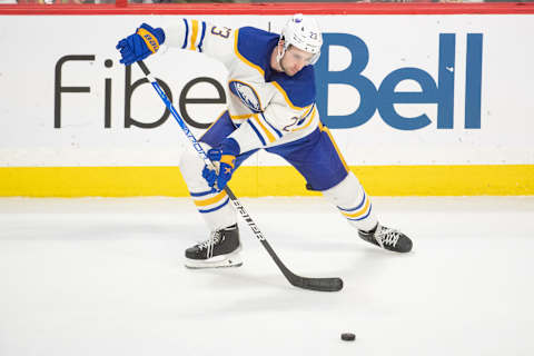 Jan 1,, 2023; Ottawa, Ontario, CAN; Buffalo Sabres defenseman Mattias Samuelsson (23) settles the puck in the third period against the Ottawa Senators at the Canadian Tire Centre. Mandatory Credit: Marc DesRosiers-USA TODAY Sports