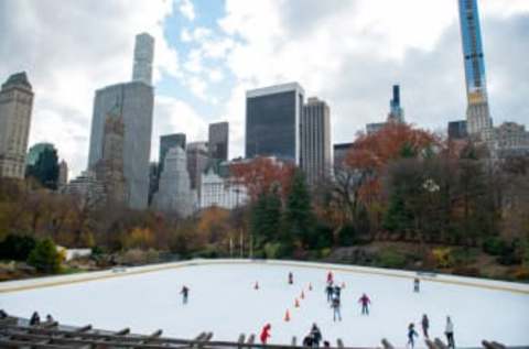 People ice skate at Wollman Rink in Central Park on November 28, 2020, in New York City. (Photo by Alexi Rosenfeld/Getty Images)