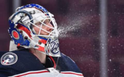 MONTREAL, QC – JANUARY 30: Goaltender Joonas Korpisalo #70 of the Columbus Blue Jackets sprays water during the first period against the Montreal Canadiens at Centre Bell on January 30, 2022, in Montreal, Canada. The Columbus Blue Jackets defeated the Montreal Canadiens 6-3. (Photo by Minas Panagiotakis/Getty Images)