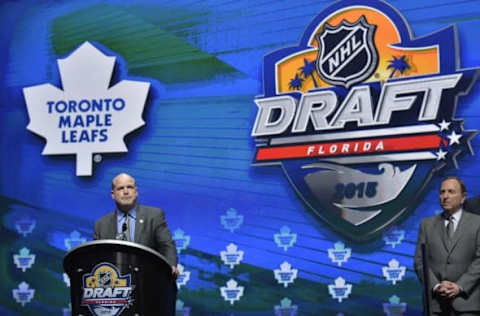 Jun 26, 2015; Sunrise, FL, USA; Toronto Maple Leafs general manager Mark Hunter announces Mitchell Marner (not pictured) as the number four overall pick to the Toronto Maple Leafs as commissioner Gary Bettman looks on in the first round of the 2015 NHL Draft at BB&T Center. Mandatory Credit: Steve Mitchell-USA TODAY Sports