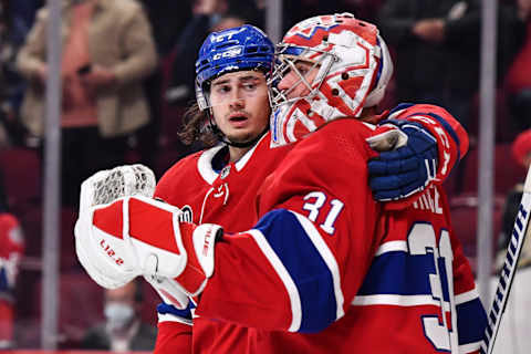 MONTREAL, QC – APRIL 29: Alexander Romanov #27 of the Montreal Canadiens hugs goaltender Carey Price #31 after defeating the Florida Panthers 10-2 at Centre Bell on April 29, 2022 in Montreal, Canada. (Photo by Minas Panagiotakis/Getty Images)