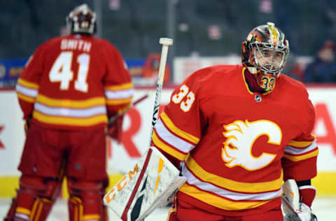 CALGARY, AB – DECEMBER 22: Calgary Flames Goalie David Rittich (33) and Goalie Mike Smith (41) warm up before an NHL game where the Calgary Flames hosted the St. Louis Blues on December 22, 2018, at the Scotiabank Saddledome in Calgary, AB. (Photo by Brett Holmes/Icon Sportswire via Getty Images)