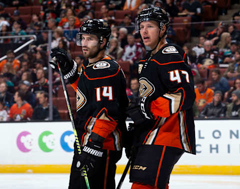 ANAHEIM, CA – MARCH 3: Adam Henrique #14 and Hampus Lindholm #47 of the Anaheim Ducks talk during a break in the second period of the game against the Colorado Avalanche at Honda Center on March 3, 2019, in Anaheim, California. (Photo by Foster Snell/NHLI via Getty Images) *** Local Caption ***