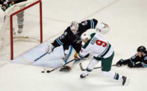 Jan 5, 2017; San Jose, CA, USA; Minnesota Wild center Mikko Koivu (9) shoots the puck against San Jose Sharks goalie Martin Jones (31) during the third period of the game at SAP Center at San Jose. The Minnesota Wild defeated the San Jose Sharks with a score of 5-4. Mandatory Credit: Stan Szeto-USA TODAY Sports