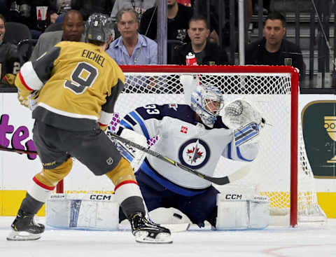 Jack Eichel #9, Vegas Golden Knights; David Rittich #33, Winnipeg Jets. (Photo by Ethan Miller/Getty Images)