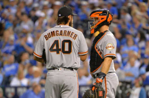 Apr 19, 2017; Kansas City, MO, USA; San Francisco Giants starting pitcher Madison Bumgarner (40) talks with catcher Nick Hundley (5) at the mound in the fourth inning against the Kansas City Royals at Kauffman Stadium. Mandatory Credit: Denny Medley-USA TODAY Sports. MLB.