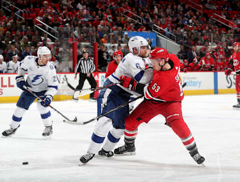 RALEIGH, NC – APRIL 7: Jeff Skinner #53 of the Carolina Hurricanes is separated from the puck on a defensive play by Anton Stralman #6 of the Tampa Bay Lightning during an NHL game on April 7, 2018 at PNC Arena in Raleigh, North Carolina. (Photo by Gregg Forwerck/NHLI via Getty Images)