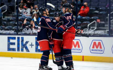 May 8, 2021; Columbus, Ohio, USA; Columbus Blue Jackets right wing Cam Atkinson (middle) celebrates with teammates center Jack Roslovic (left) and right wing Patrik Laine (right) after scoring a goal against the Detroit Red Wings in the 1st period at Nationwide Arena. Mandatory Credit: Aaron Doster-USA TODAY Sports