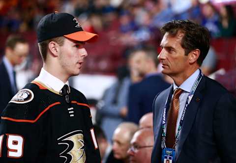 VANCOUVER, BRITISH COLUMBIA – JUNE 21: Brayden Tracey, 29th overall pick of the Anaheim Ducks, talks with head coach Dallas Eakins on the draft floor during Rounds 2-7 of the 2019 NHL Draft at Rogers Arena on June 22, 2019 in Vancouver, Canada. (Photo by Jeff Vinnick/NHLI via Getty Images)