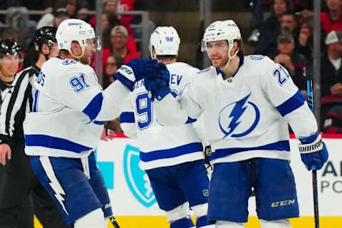 Mar 28, 2023; Raleigh, North Carolina, USA; Tampa Bay Lightning center Brayden Point (21) is congratulated by center Steven Stamkos (91) after his goal against the Carolina Hurricanesd3p at PNC Arena. Mandatory Credit: James Guillory-USA TODAY Sports