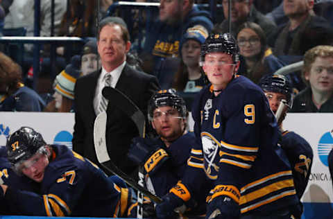 BUFFALO, NY – FEBRUARY 5: Head coach Phil Housley, Casey Mittelstadt #37, Conor Sheary #43 and Jack Eichel #9 of the Buffalo Sabres watch the action during an NHL game against the Minnesota Wild on February 5, 2019 at KeyBank Center in Buffalo, New York. (Photo by Bill Wippert/NHLI via Getty Images)