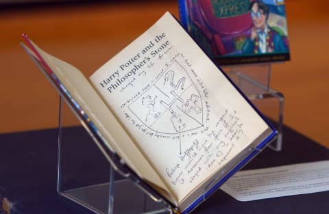 A signed early edition of 'Harry Potter and the Philosopher's Stone' on display