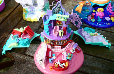 Open Polly Pocket sets on a table