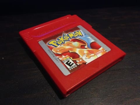 A red Pokémon game cartridge