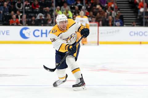 Mar 12, 2023; Anaheim, California, USA; Nashville Predators defenseman Tyson Barrie (22) shoots the puck during the first period against the Anaheim Ducks at Honda Center. Mandatory Credit: Kiyoshi Mio-USA TODAY Sports