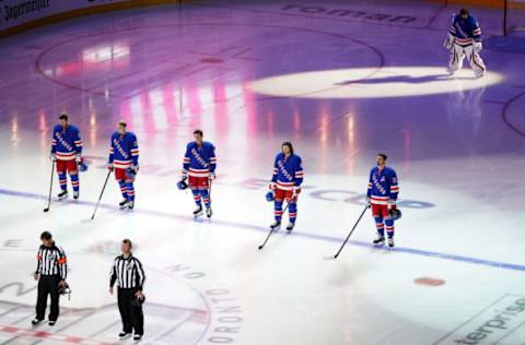 The New York Rangers stand on the ice prior to Game Three against the Carolina Hurricanes in the Eastern Conference Qualification Round. (Photo by Andre Ringuette/Freestyle Photo/Getty Images)