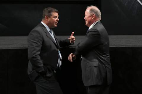 PITTSBURGH, PA: Dave Nonis and Bob Murray discuss matters during Round One of the 2012 NHL Entry Draft on June 22, 2012. (Photo by Bruce Bennett/Getty Images)