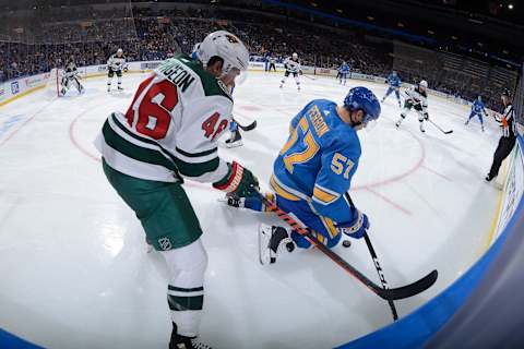 ST. LOUIS, MO – NOVEMBER 3: Jared Spurgeon #46 of the Minnesota Wild and David Perron #57 of the St. Louis Blues battle for the puck at Enterprise Center on November 3, 2018 in St. Louis, Missouri. (Photo by Joe Puetz/NHLI via Getty Images)