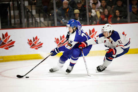 Samuel Honzek drives to the net against Team USA during their game in the 2023 IIHF World Junior Championship. (Photo by Dale Preston/Getty Images)