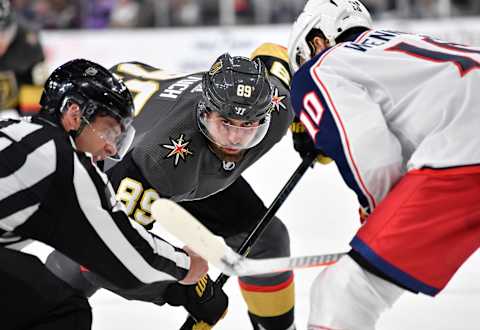 LAS VEGAS, NEVADA – JANUARY 11: Alex Tuch #89 of the Vegas Golden Knights faces off with Alexander Wennberg #10 of the Columbus Blue Jackets during the third period at T-Mobile Arena on January 11, 2020 in Las Vegas, Nevada. (Photo by Jeff Bottari/NHLI via Getty Images)