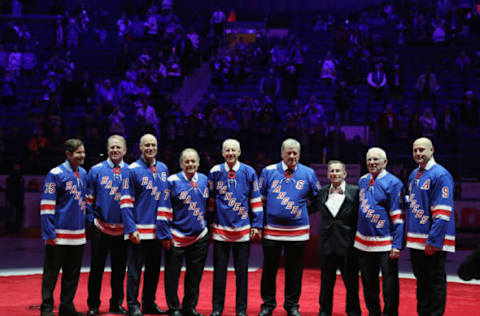 Mike Richter, Brian Leetch, Mark Messier, Rod Gilbert, Jean Ratelle, Vic Hadfield, Emile Francis, Ed Giacomin and Adam Graves attend Hadfield’s jersey retire (Photo by Bruce Bennett/Getty Images)