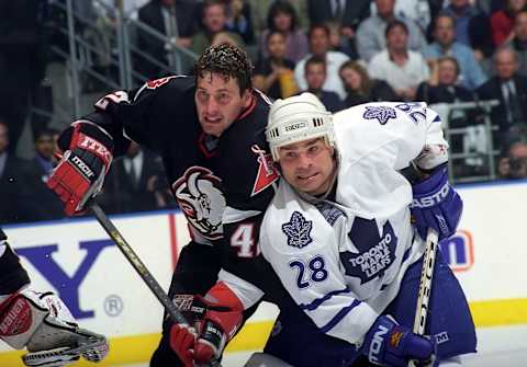 TORONTO, ON – MAY 23: Tie Domi #28 of the Toronto Maple Leafs skates against Richard Smehlik #42 the Buffalo Sabres during the 1999 NHL Semi-Final playoff game action at Air Canada Centre in Toronto, Ontario, Canada. (Photo by Graig Abel/Getty Images)