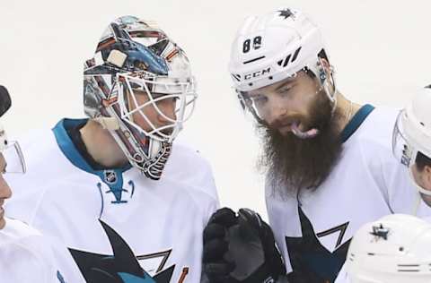 NHL Power Rankings: San Jose Sharks goalie Martin Jones (31) and San Jose Sharks defenseman Brent Burns (88) celebrate their 4-1 win over the New Jersey Devils at Prudential Center. Mandatory Credit: Ed Mulholland-USA TODAY Sports