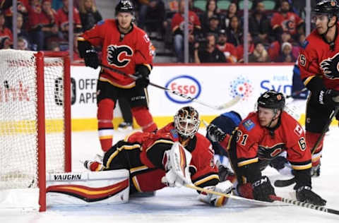 Oct 2, 2016; Calgary, Alberta, CAN; Calgary Flames goalie Chad Johnson (31) watches the puck go past against the Winnipeg Jets during the first period at Scotiabank Saddledome. Mandatory Credit: Candice Ward-USA TODAY Sports