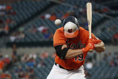 BALTIMORE, MD – AUGUST 11: Chris Davis #19 of the Baltimore Orioles is hit by a pitch thrown by Hector Velazquez #76 of the Boston Red Sox (not pictured) in the second inning during game two of a doubleheader at Oriole Park at Camden Yards on August 11, 2018 in Baltimore, Maryland. (Photo by Patrick McDermott/Getty Images)