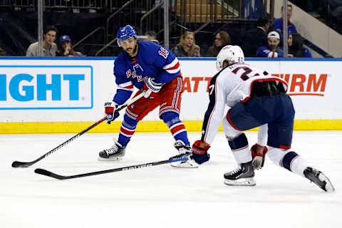 NEW YORK, NEW YORK – NOVEMBER 12: Vincent Trocheck #16 of the New York Rangers controls the puck as Adam Boqvist #27 of the Columbus Blue Jackets defends during the second period at Madison Square Garden on November 12, 2023 in New York City. (Photo by Sarah Stier/Getty Images)