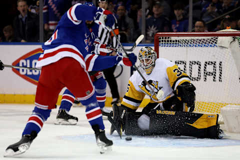 Mar 25, 2022; New York, New York, USA; New York Rangers center Frank Vatrano (77) scores a goal against Pittsburgh Penguins goaltender Tristan Jarry (35) during the first period at Madison Square Garden. Mandatory Credit: Brad Penner-USA TODAY Sports