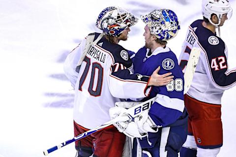 Joonas Korpisalo #70 of the Columbus Blue Jackets and Andrei Vasilevskiy #88 of the Tampa Bay Lightning (Photo by Elsa/Getty Images)